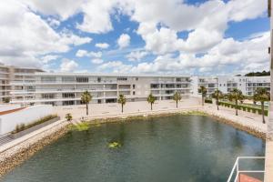 an apartment building with a pool in front of it at Marina Lovers by Seewest in Lagos