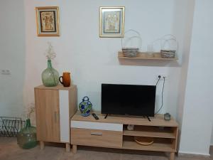 TV a/nebo společenská místnost v ubytování CAL TIO PAU