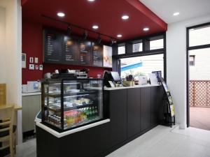 a fast food restaurant with a counter with food at Korea guesthouse in Gumi