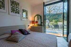 En eller flere senge i et værelse på Leone - Family Friendly House + 29 billeder