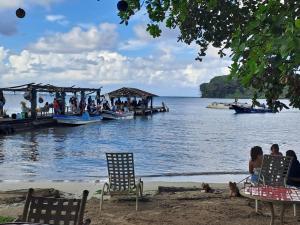 a group of people on boats on the water at Villa Bella in Portobelo