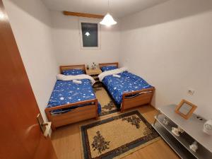 A bed or beds in a room at Vikendica Mostar