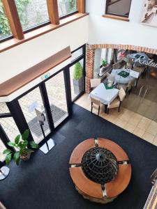 an overhead view of a restaurant with a table and chairs at Penzión pod kláštorom in Pezinok