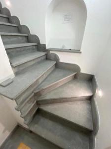 a set of concrete stairs in a room at Appartamenti Holiday Housing Lipari Centro in Lipari