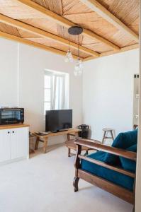 TV a/nebo společenská místnost v ubytování ΜOOI KATRINS