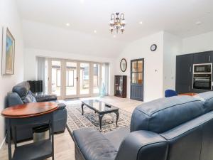 a living room with a couch and a table at The Granary in Norwich