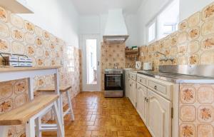 a kitchen with a sink and a stove at Abrotea Apartments in Lagos +16 photos