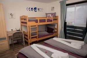 Postel nebo postele na pokoji v ubytování Ferienwohnung Winklworld inklusive aktivCARD + 29 fotografií
