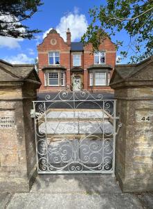 an iron gate in front of a house at 1 Bed / 1 Sofa Bed 'Scandi' Style Ground Floor Apartment in Yeovil