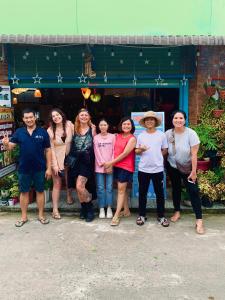 a group of people standing in front of a store at Canary Bungalow in Phu Quoc