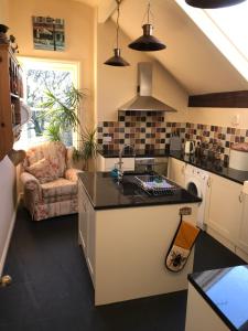 a kitchen with a sink and a counter top at Large Ingleton Apartment, Yorkshire Dales, Three Peaks in Ingleton 