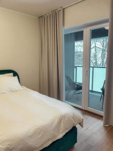 Cama o camas de una habitación en Keila Central Apartment