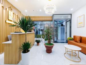 a lobby of a store with potted plants at Muse Hanoi Boutique Apartment in Hanoi