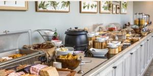 a buffet with a lot of food on a counter at Fort Magruder Historic Williamsburg, Trademark by Wyndham in Williamsburg