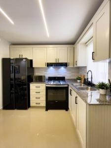 Kuchyň nebo kuchyňský kout v ubytování Apartment Exclusive cercano a Embajada Americana