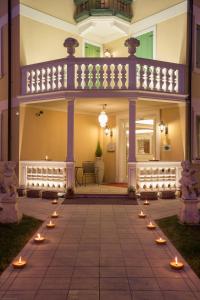 a patio with candles in front of a house at Hotel Doge in Vicenza