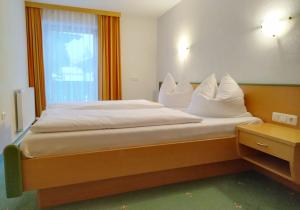 Postel nebo postele na pokoji v ubytování Haus Brandhofer