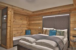 Voodi või voodid majutusasutuse Sieglhub Chalets - Appartements - Hotel toas