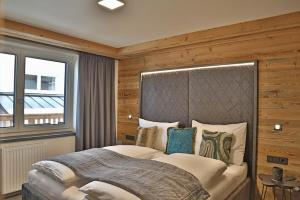Voodi või voodid majutusasutuse Sieglhub Chalets - Appartements - Hotel toas