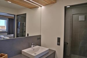 Vannituba majutusasutuses Sieglhub Chalets - Appartements - Hotel