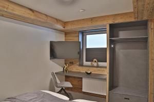 Televiisor ja/või meelelahutuskeskus majutusasutuses Sieglhub Chalets - Appartements - Hotel