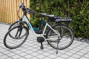 two bikes parked next to each other on a sidewalk at Ferienhaus "Q" - Wohnung 3 in Zingst