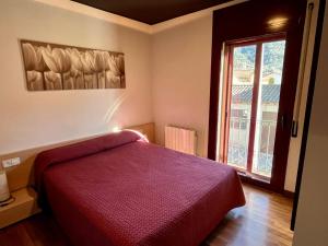 Posteľ alebo postele v izbe v ubytovaní Can Morera Apartaments a Les Preses