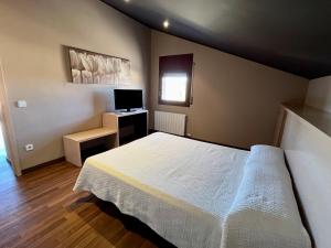 Posteľ alebo postele v izbe v ubytovaní Can Morera Apartaments a Les Preses