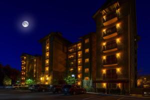 a hotel at night with the moon in the sky at RiverStone Condo Resort & Spa in Pigeon Forge