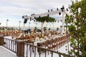 a table set up for a wedding on a deck at Crowne Plaza Florya Istanbul by IHG in Istanbul
