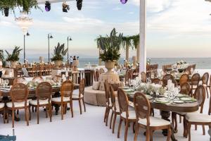 a table set up for a wedding with the ocean in the background at Crowne Plaza Florya Istanbul by IHG in Istanbul