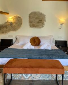 a bed with a pillow on top of it at Konstantino's Place in Samos