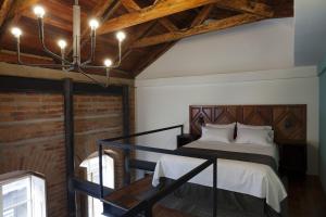 Voodi või voodid majutusasutuse Carlota Sustainable Design Hotel toas