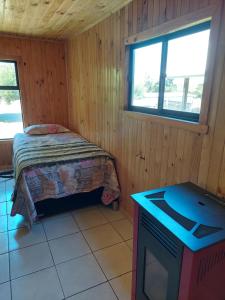 Voodi või voodid majutusasutuse Cabaña Loft Curaco de Vélez toas