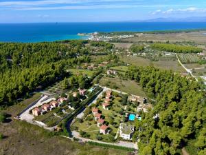 an aerial view of a village with houses and the ocean at Sani Polyastron Hotel & Spa in Sani Beach