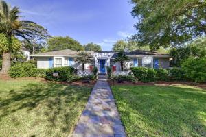 a house with a cobblestone path in the yard at Coastal Dream - 2232 Ocean Rd in Saint Simons Island