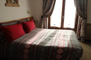 Postel nebo postele na pokoji v ubytování Hotel Bucaneve