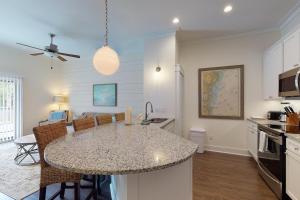 a kitchen with a island in the middle of a room at King Suite @ 400 Ocean Suites in King City