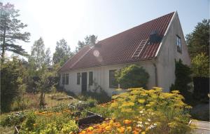 a house with a garden in front of it at Amazing Home In Visby With 3 Bedrooms And Wifi in Visby