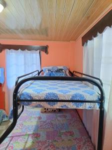 Ένα ή περισσότερα κρεβάτια σε δωμάτιο στο Hostal Familiar Noemi