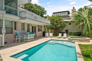 a swimming pool in the backyard of a house at 44 Dune House - 1901 Dixon Lane in Saint Simons Island