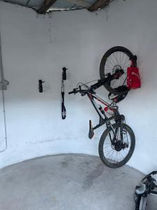 a bike hanging on a wall in a garage at B&B La DORMERIA in Finale Ligure