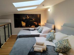 Posteľ alebo postele v izbe v ubytovaní Hugo VIP Apartments