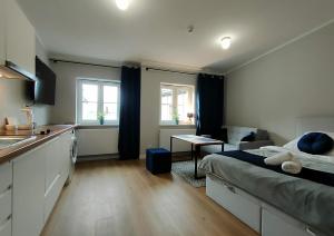 Posteľ alebo postele v izbe v ubytovaní Hugo VIP Apartments