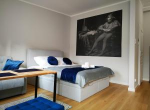 Posteľ alebo postele v izbe v ubytovaní Hugo VIP Apartments