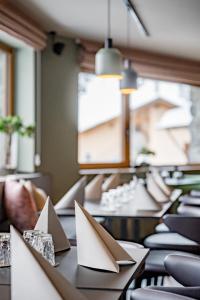 a row of desks with paper on them at The Moss - Your unique hideaway in Obergurgl +59 photos