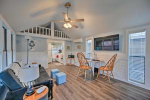 a living room with a couch and a table and chairs at Everglades City Cabin Dock and Heated Pool! in Everglades City