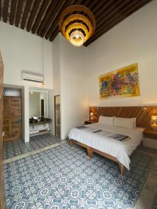 Postel nebo postele na pokoji v ubytování NaNa Vida Hotel Morelia