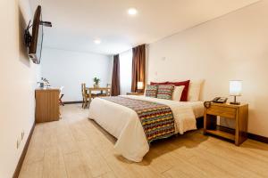 Postel nebo postele na pokoji v ubytování Hotel Carretero
