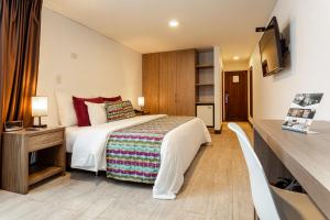Postel nebo postele na pokoji v ubytování Hotel Carretero